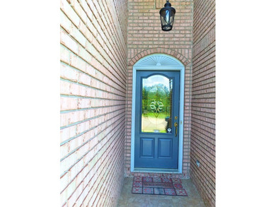 Tour this well-maintained 3BR/2BA custom brick home located in