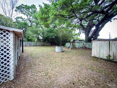 This cozy 4-bedroom, 2-bath block home offers a functional - photo 29