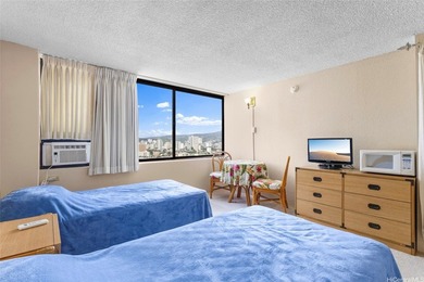 Situated in the heart of Waikiki, this high-floor unit at - photo 4