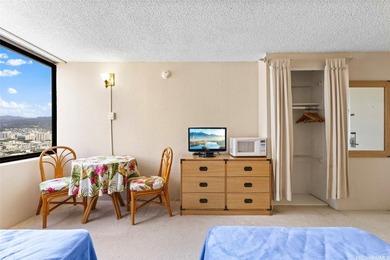 Situated in the heart of Waikiki, this high-floor unit at - photo 8