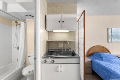 Situated in the heart of Waikiki, this high-floor unit at - photo 9
