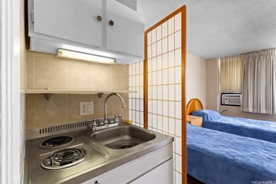 Situated in the heart of Waikiki, this high-floor unit at - photo 10