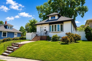 Welcome to 106 Hillcrest Avenue, a single-family detached raised - photo 5