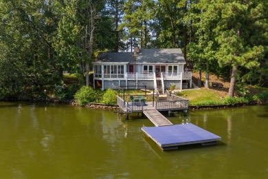 Nestled on 280 feet of waterfrontage at the water's edge! The - Lake Home Sale Pending in Hamilton, Georgia