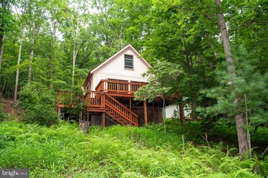 Bring your vision to this 1-bedroom, 1-bath chalet in the - photo 1