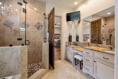 Exceptional lakefront living begins with a striking stone - photo 16