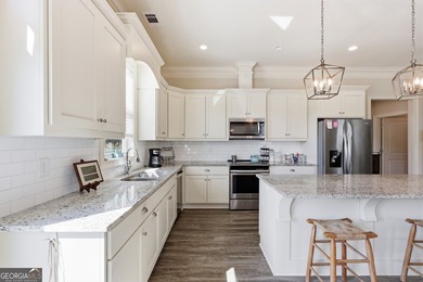 Welcome to this spacious 4 bedroom, 3 bath home in the highly - photo 9