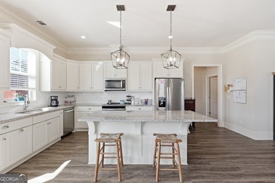 Welcome to this spacious 4 bedroom, 3 bath home in the highly - photo 10