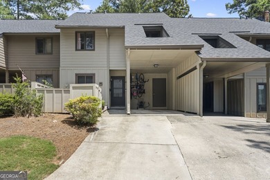 Welcome to this inviting end-unit townhome nestled in the highly - photo 2