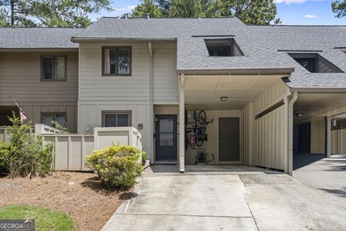 Welcome to this inviting end-unit townhome nestled in the highly - photo 3