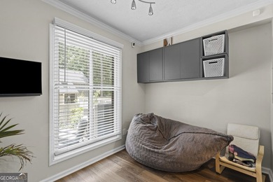 Welcome to this inviting end-unit townhome nestled in the highly - photo 6
