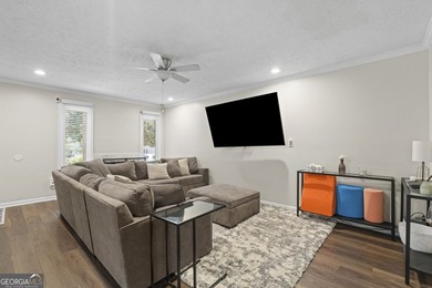 Welcome to this inviting end-unit townhome nestled in the highly - photo 9