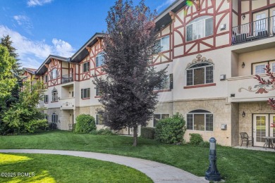 This stunning top-floor condo features charming vaulted wood