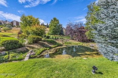 This stunning top-floor condo features charming vaulted wood