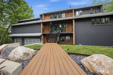 Positioned on 155' of waterfront in a deep-water cove, this - photo 3
