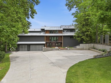 Positioned on 155' of waterfront in a deep-water cove, this - photo 4
