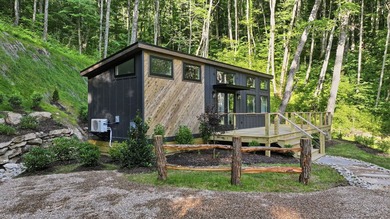 Perched on 1.12 private acres, this custom-built Timbercraft - photo 1