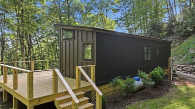 Perched on 1.12 private acres, this custom-built Timbercraft - photo 5