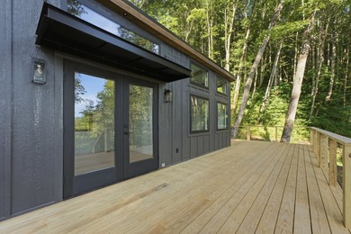 Perched on 1.12 private acres, this custom-built Timbercraft - photo 7