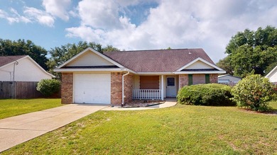 This 3-bedroom, 2-bath home with an attached 1-car garage is - photo 1