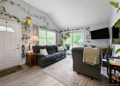 Spacious and open floor plan with cathedral ceilings welcome you - photo 3