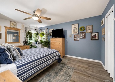 Spacious and open floor plan with cathedral ceilings welcome you - photo 10