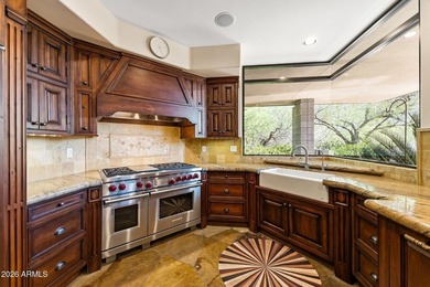 Tucked into a private Desert Mountain setting, this - photo 4