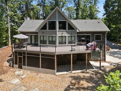 Experience exceptional lakefront living in this custom-built - photo 1