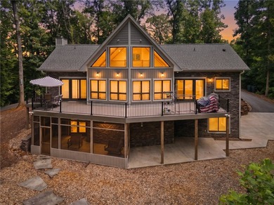 Experience exceptional lakefront living in this custom-built - photo 2