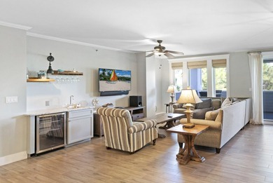 Perfectly positioned as a rare end-unit residence, this - photo 2