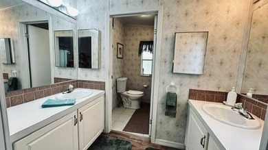 This charming 2-bedroom, 2-bathroom plus den mobile home offers - photo 11
