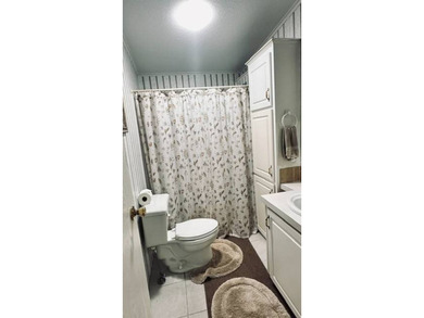 This charming 2-bedroom, 2-bathroom plus den mobile home offers - photo 14