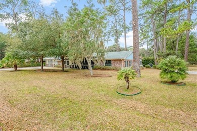 Set beneath a quiet canopy of live oaks, 636 Old Plantation Road - photo 15