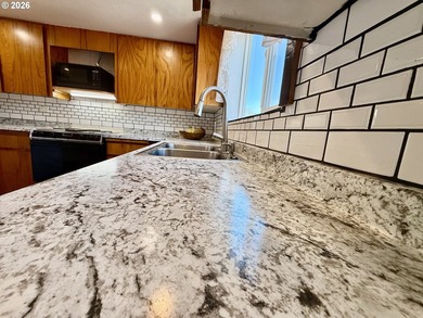 Take in the bay views while enjoying a blazing fire in this - photo 18