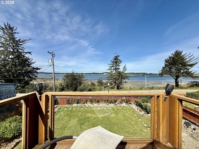 Take in the bay views while enjoying a blazing fire in this - photo 33