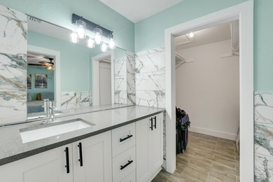This stunning two-story residence has been completely remodeled - photo 19