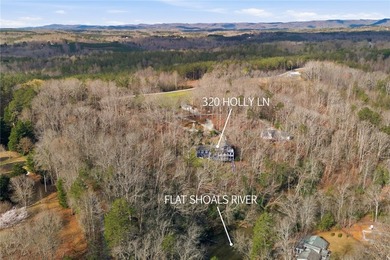 Experience the best of riverfront living with this custom-built - photo 3