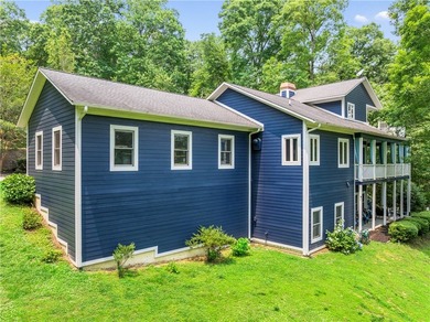 Experience the best of riverfront living with this custom-built - photo 8