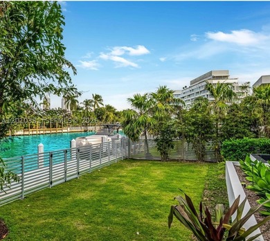 This one-of-a-kind, two-story waterfront villa, designed by - photo 16