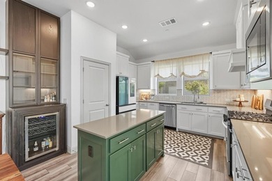 This rare one-story end-unit townhome is designed for worry-free