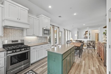 This rare one-story end-unit townhome is designed for worry-free