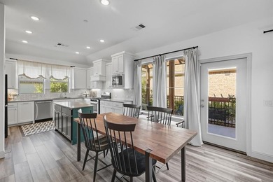 This rare one-story end-unit townhome is designed for worry-free