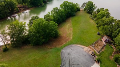 Wow!! What a great piece of property! This level lakefront lot - photo 2