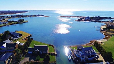 Set on 0.63 acres with waterside pool and 110Ft of bulkhead - photo 3