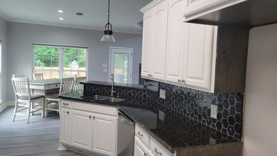REDUCED! Make your move to Rayburn Country! This versatile home - photo 9