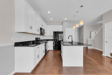 Short Sale. Welcome to a townhouse that makes everyday living - photo 4