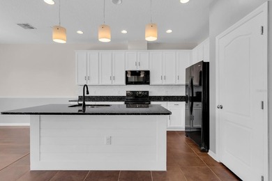 Short Sale. Welcome to a townhouse that makes everyday living - photo 8