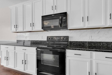 Short Sale. Welcome to a townhouse that makes everyday living - photo 9