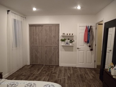 Enjoy easy living in this spacious two-bedroom apartment located - photo 2