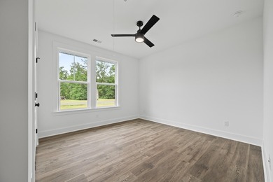 The Fischer plan offers easy main-level living with Lowcountry - photo 12